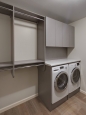 Laundry Section of Walk In Closet in Brushed Gray Finish